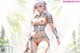 A woman in silver armor holding a sword stands outdoors with sunlight filtering through trees.